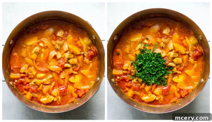 Hearty Butternut Chicken Stew 6 A Dutch oven filled with simmering chicken stew with butternut squash, topped with fresh green parsley, ready to be served.