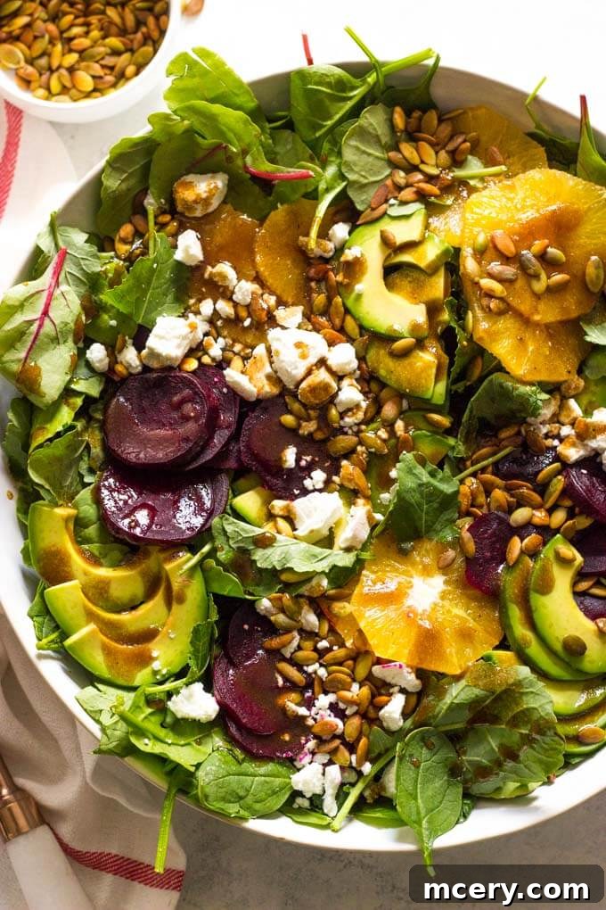 Vibrant Roasted Beet and Avocado Salad 2 Close up of roasted beet salad with avocado in white bowl