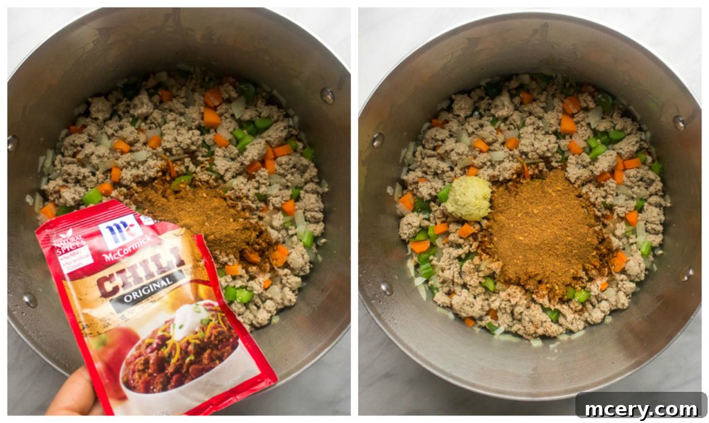 Close up of cooked vegetables with spices and beans stirred into a dutch oven for sweet and spicy chili.