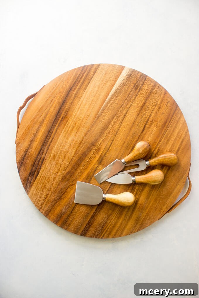 The Art of Cheese Boards 4 Cheese board with cheese servers and knives