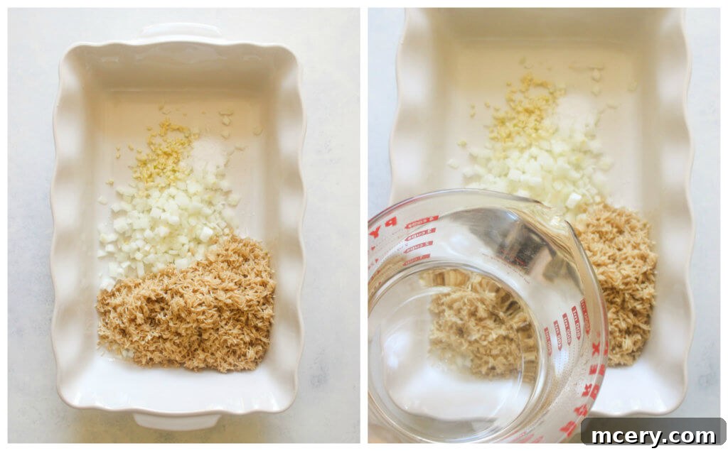 One Pan Teriyaki Chicken and Rice Bake 4 Uncooked brown rice, chopped onions, garlic, and hot water combined in a white casserole dish, the first step for baked teriyaki chicken.