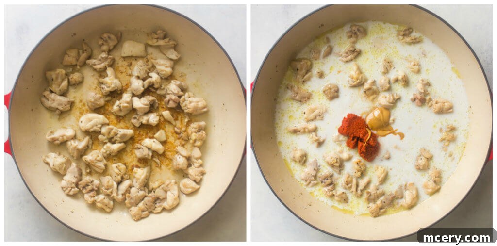 Chicken browning in a saute pan with red curry paste and coconut milk being added, forming a rich base