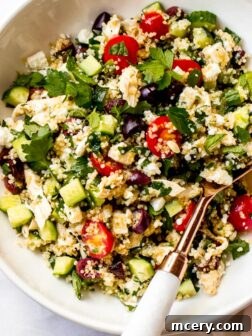 Close up of lemon chicken quinoa salad in white bowl