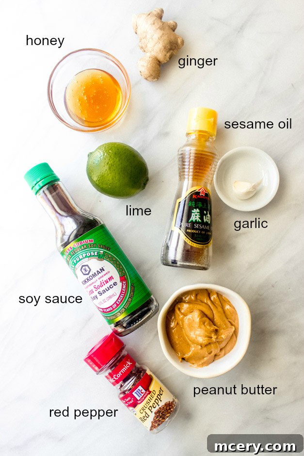 Easy Homemade Veggie Rolls 6 Collection of ingredients for making peanut sauce for spring rolls, including peanut butter, lime, soy sauce, honey, ginger, garlic, and red pepper flakes.