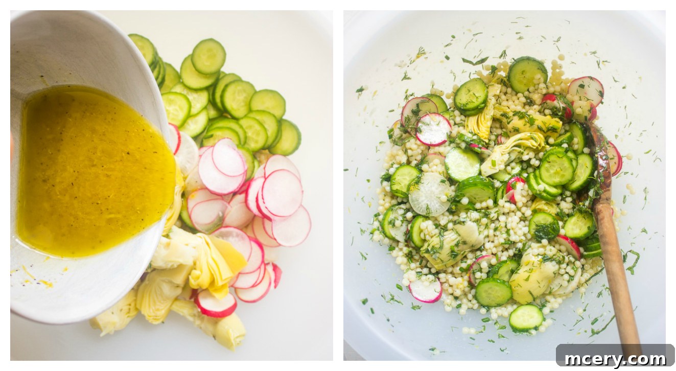 Jeweled Israeli Couscous Salad 7 A large white bowl of pearl couscous salad with dressing, ready for chilling.