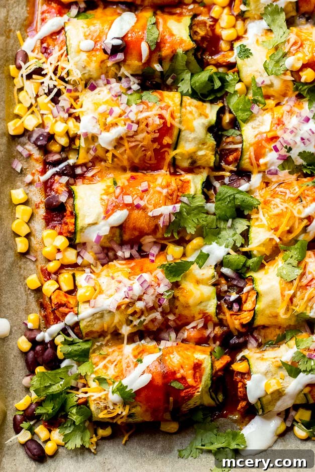 One Pan Zucchini Chicken Enchiladas 3 Close up view of the crispy, cheesy topping on Zucchini Chicken Enchiladas