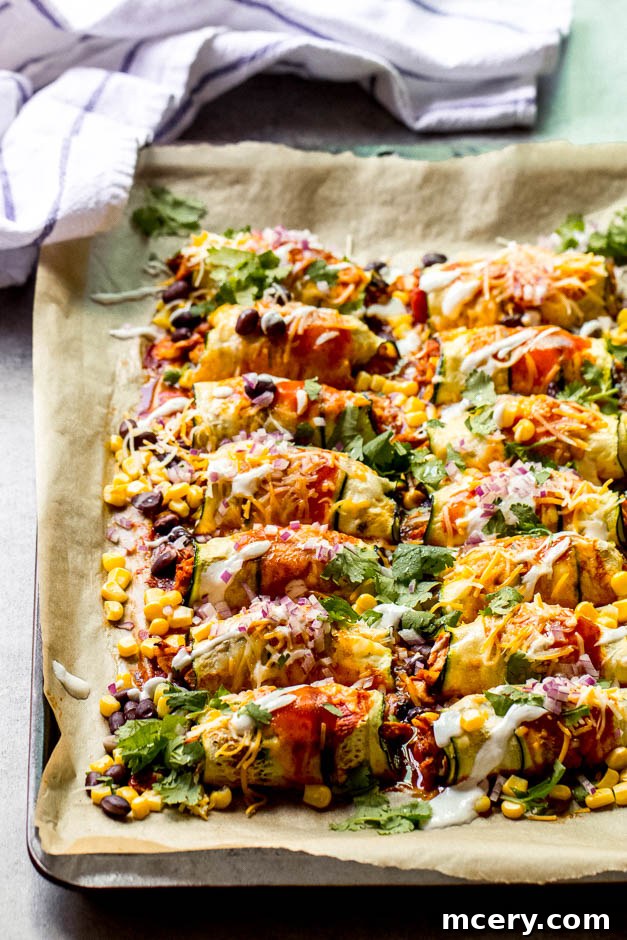 One Pan Zucchini Chicken Enchiladas 6 Side view of a serving of zucchini chicken enchiladas, showing the layers of filling