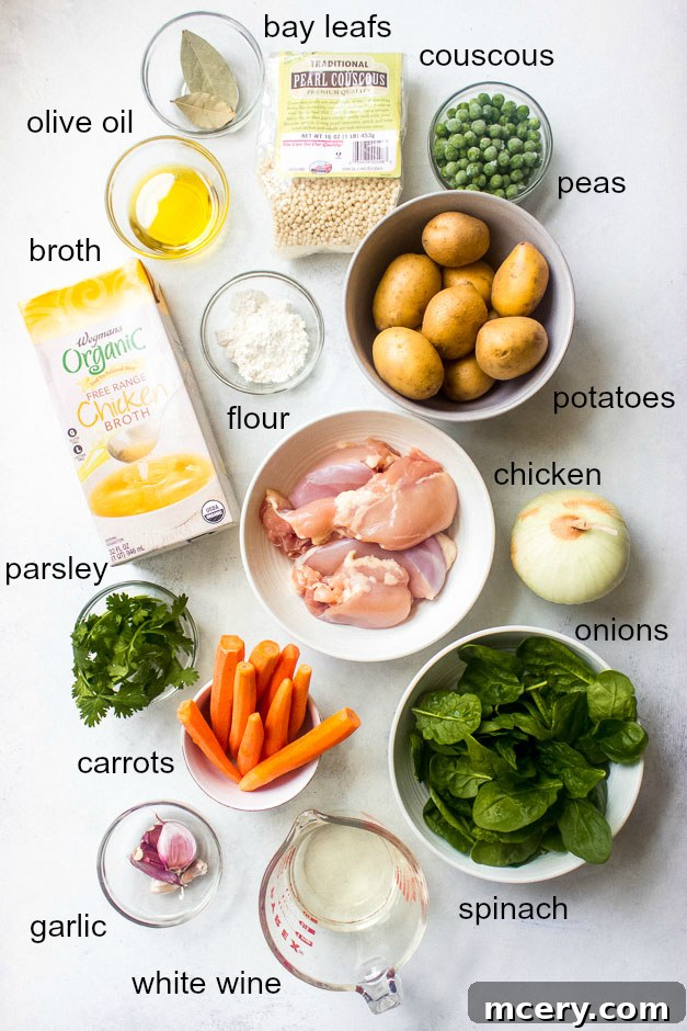 Tender Spring Chicken and Garden Harvest Stew 3 Selection of fresh ingredients laid out for a chicken thigh stew recipe, including boneless chicken thighs, baby carrots, baby potatoes, onions, garlic, and pearl couscous.