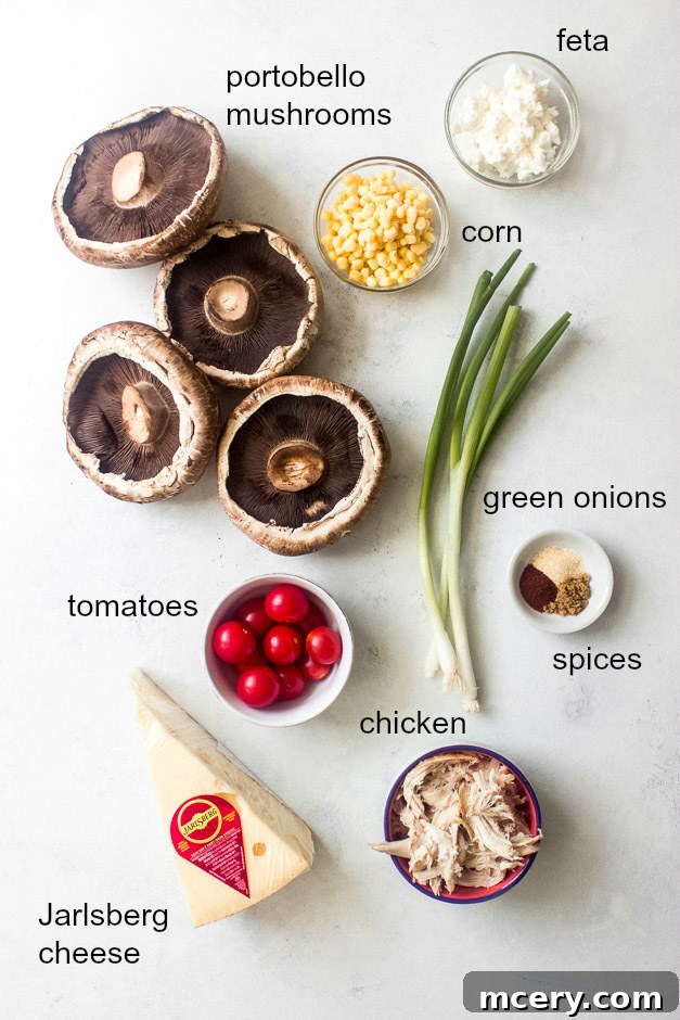 Loaded Chicken Corn and Cheese Portobellos 4 A colorful array of ingredients for the easy chicken stuffed portobello mushroom recipe, including chicken, corn, tomatoes, Jarlsberg and feta cheeses, and various spices, laid out on a clean kitchen counter.