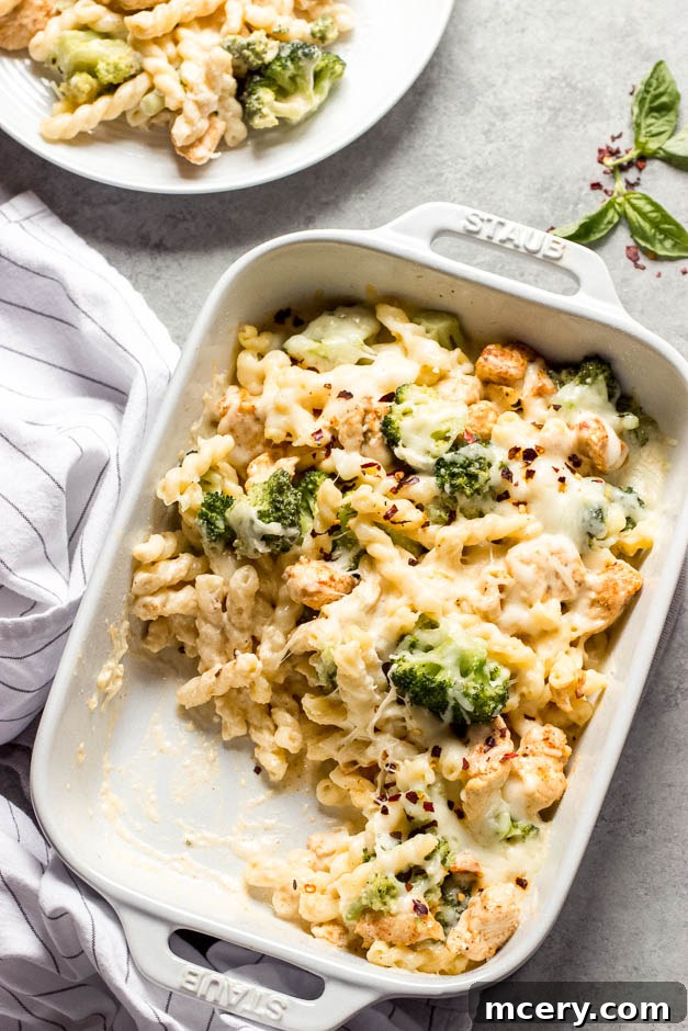 Creamy Chicken Broccoli Pasta Bake 2 Overhead side view of a delicious chicken and broccoli pasta bake, ready to serve.