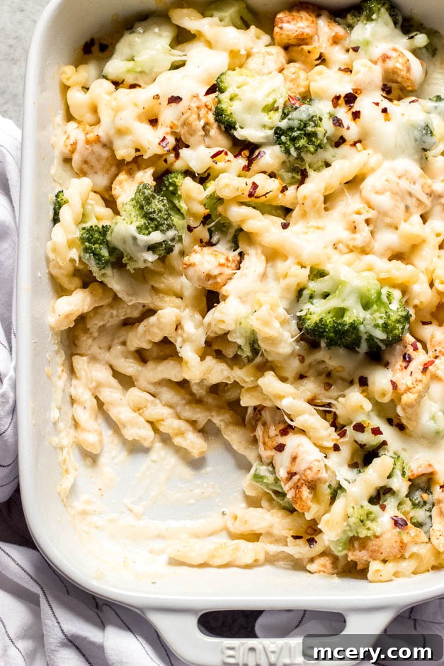 Creamy Chicken Broccoli Pasta Bake 3 Overhead close up of a golden-brown chicken and broccoli bake recipe, fresh from the oven.