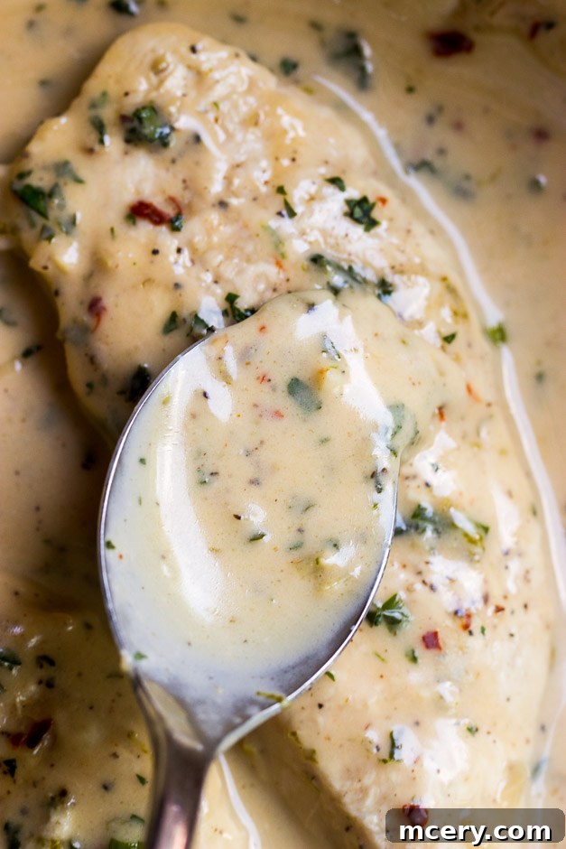 Creamy Coconut Chicken Skillet 13 Close up of delicious coconut lime sauce coating tender chicken pieces, ready for serving.