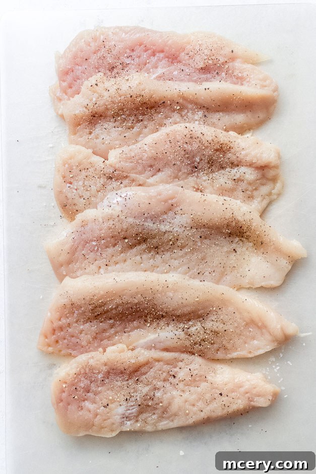 Creamy Coconut Chicken Skillet 5 Chicken breast seasoned generously with salt and black pepper.