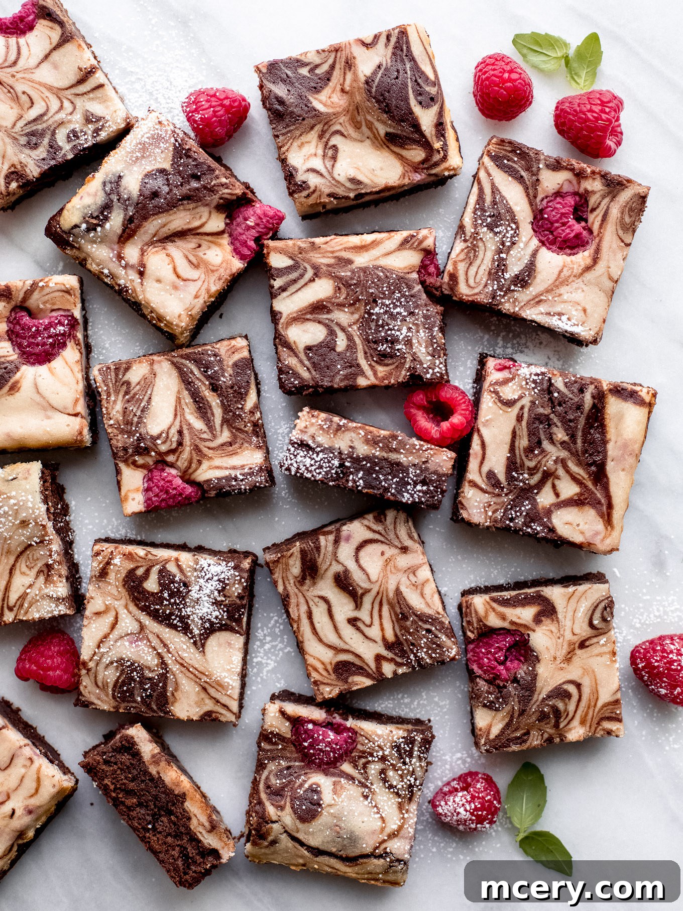 Tangy Raspberry Fudge Brownies 12 Delicious Raspberry Cheesecake Brownies arranged beautifully for serving