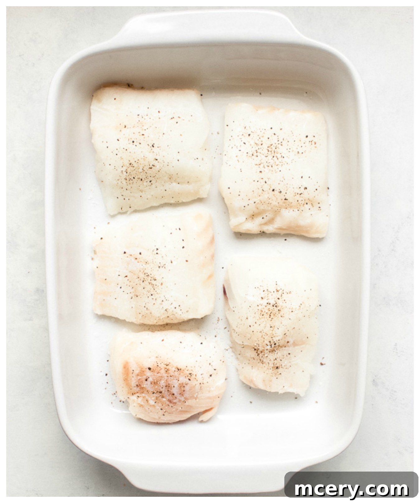 Crispy Panko Cod Bake 5 Baked cod recipe showing seasoned cod fillets ready for topping