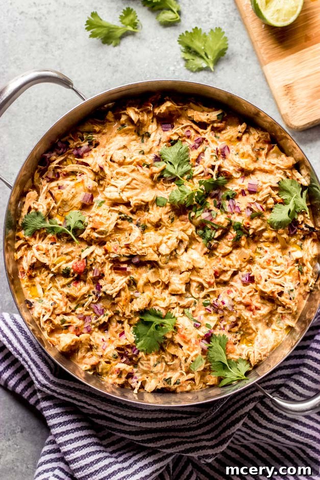Simple Skillet Creamy Shredded Chicken 2 Rich, creamy shredded chicken served in a rustic dutch oven, perfect for meal prep or quick dinners.