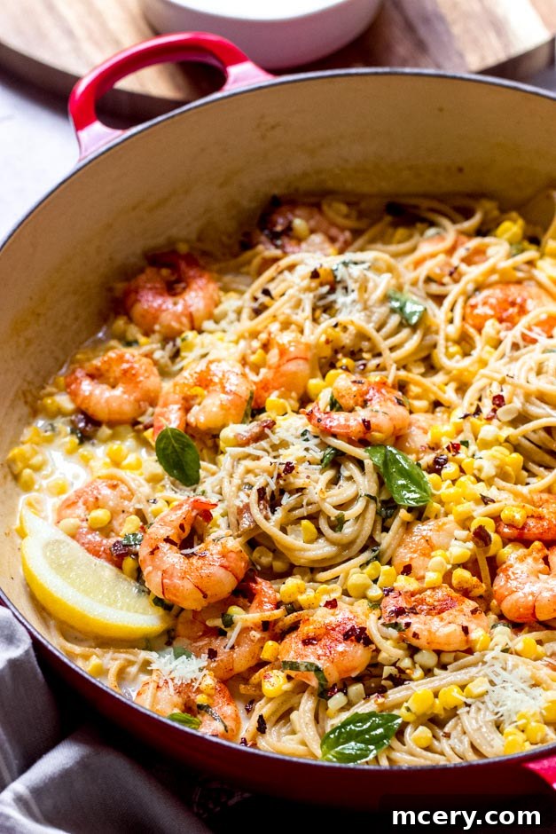 Zesty Shrimp and Sweet Corn Pasta 2 close up view of creamy shrimp corn pasta in a saute pan