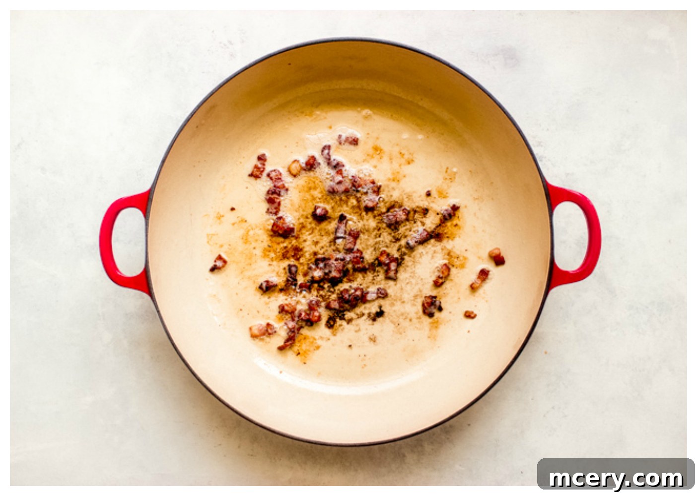 Zesty Shrimp and Sweet Corn Pasta 4 Crispy cooked bacon in a skillet, ready to be removed