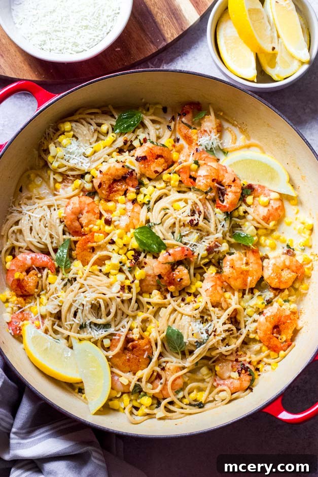 Zesty Shrimp and Sweet Corn Pasta 9 Overhead shot of creamy corn spaghetti with shrimp, garnished and ready to serve