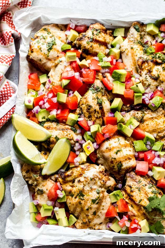 Fresh & Fast: Cilantro Lime Chicken with Creamy Avocado Salsa 3 Close up shot of juicy grilled cilantro lime chicken, perfectly seasoned and ready to serve.