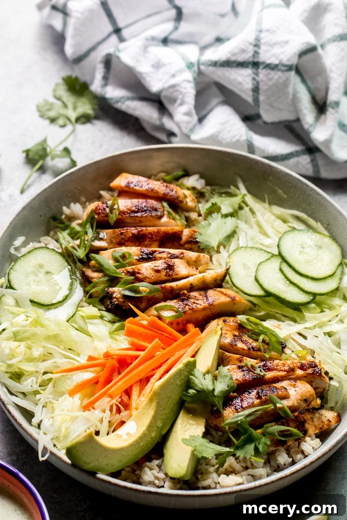Grilled Chicken Spring Roll Salad Bowl 3 Close-up of a vibrant and healthy spring roll bowl recipe, showcasing grilled chicken, fresh vegetables, and dressing.