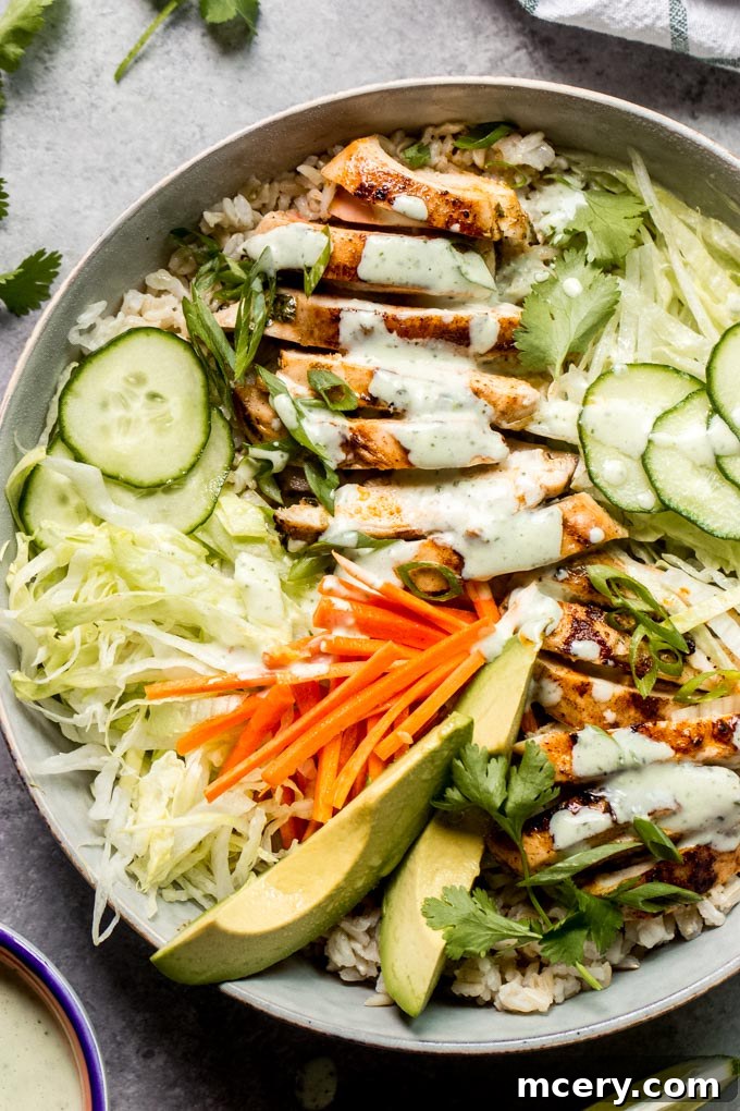 Grilled Chicken Spring Roll Salad Bowl 8 Close-up of a vibrant chicken bowl with rice, grilled chicken, and fresh cilantro lime dressing.