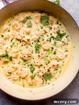 Shrimp in creamy coconut milk sauce, garnished and ready to serve