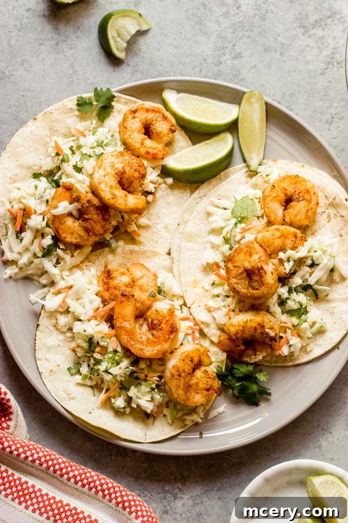 Fiery Shrimp Taco Fiesta 9 A perfectly assembled spicy shrimp taco with fresh ingredients, ready to be enjoyed.