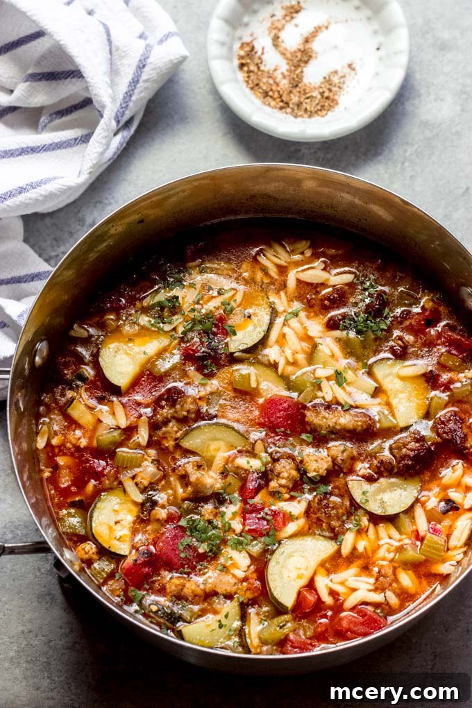 Hearty Sausage Zucchini Stew 2 A large pot filled with delicious sausage zucchini soup, ready to be served, capturing the hearty and comforting essence of the dish.