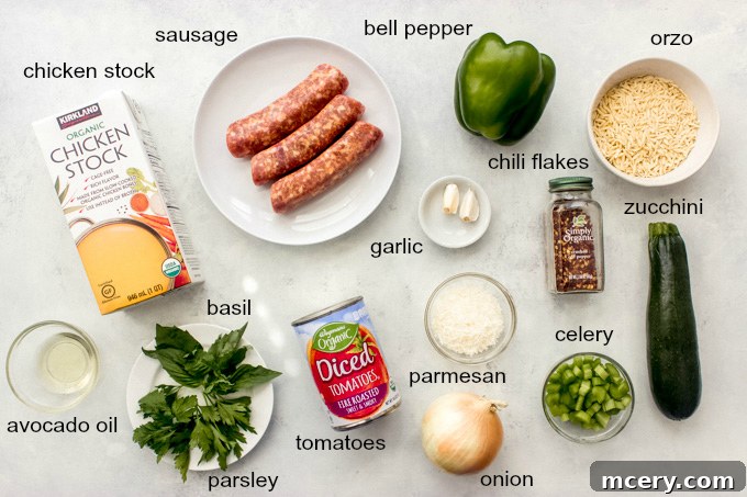 Hearty Sausage Zucchini Stew 4 A vibrant collection of fresh ingredients laid out, including Italian sausage, zucchini, bell peppers, onions, celery, herbs, and canned tomatoes, essential for the delicious sausage zucchini soup.