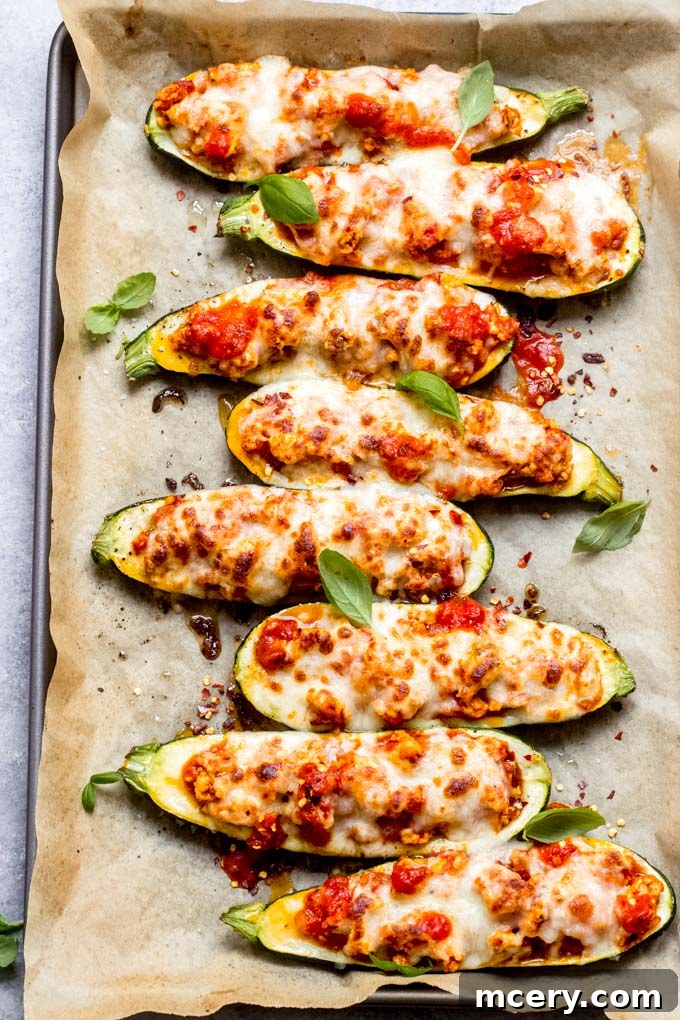 Delectable Chicken Zucchini Boats 2 Delicious overhead view of chicken stuffed zucchini boats ready to be served