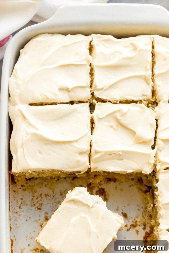 Southern Hummingbird Slab Cake 2 Delicious and easy Hummingbird Sheet Cake topped with cream cheese frosting, ready to be served from a baking pan.