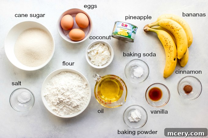 Southern Hummingbird Slab Cake 4 A selection of fresh and dry ingredients for making Hummingbird Sheet Cake, including bananas, pineapple, coconut, flour, sugar, and spices.