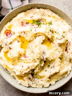 Red skin mashed potatoes with cream cheese, beautifully plated.