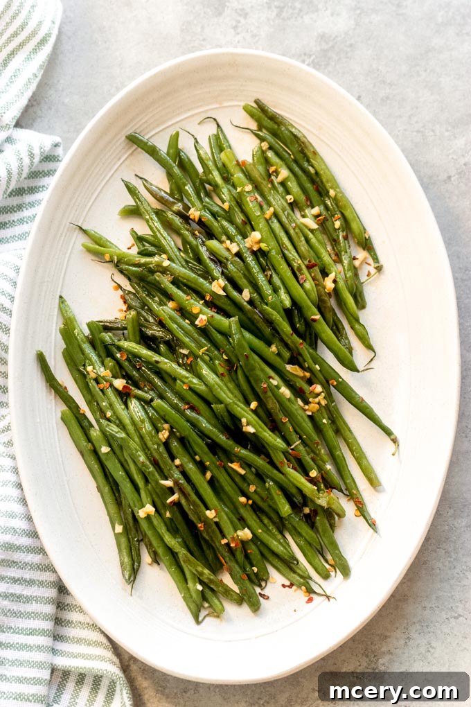 Sesame Garlic Green Beans 2 Delicious Asian green beans seasoned with sweet and spicy sauce, ready to serve.