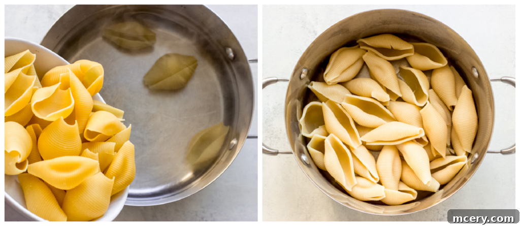 Golden Baked Italian Sausage Stuffed Shells 4 Cooked jumbo pasta shells resting in a colander after being boiled, ready for stuffing.