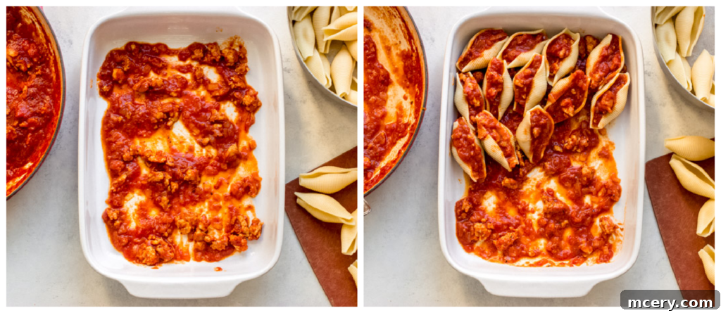 Golden Baked Italian Sausage Stuffed Shells 7 A baking dish filled with jumbo pasta shells, generously stuffed with a savory meat filling and ready for cheese and baking.