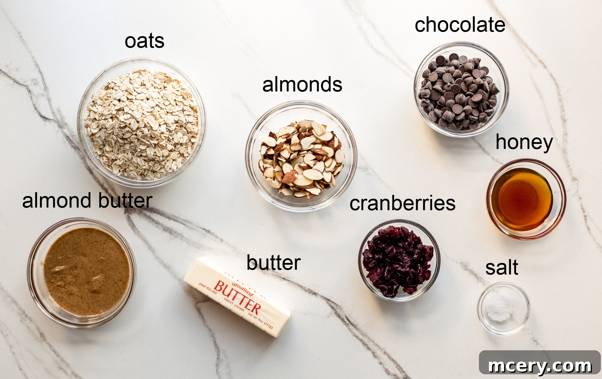 Ingredients for no-bake chocolate oat bars laid out on a surface