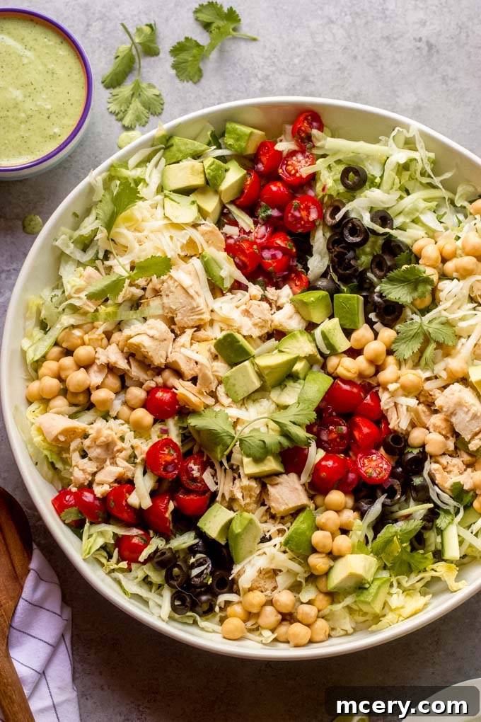 Zesty Mexican Tuna Salad with Cilantro Cream 2 Vibrant Chopped Mexican Tuna Salad with fresh avocado and creamy cilantro dressing, garnished with cilantro.