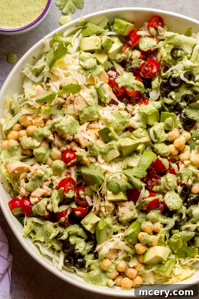 Zesty Mexican Tuna Salad with Cilantro Cream 9 A serving of Chopped Mexican Tuna Salad with creamy cilantro dressing on a plate, ready to be enjoyed.