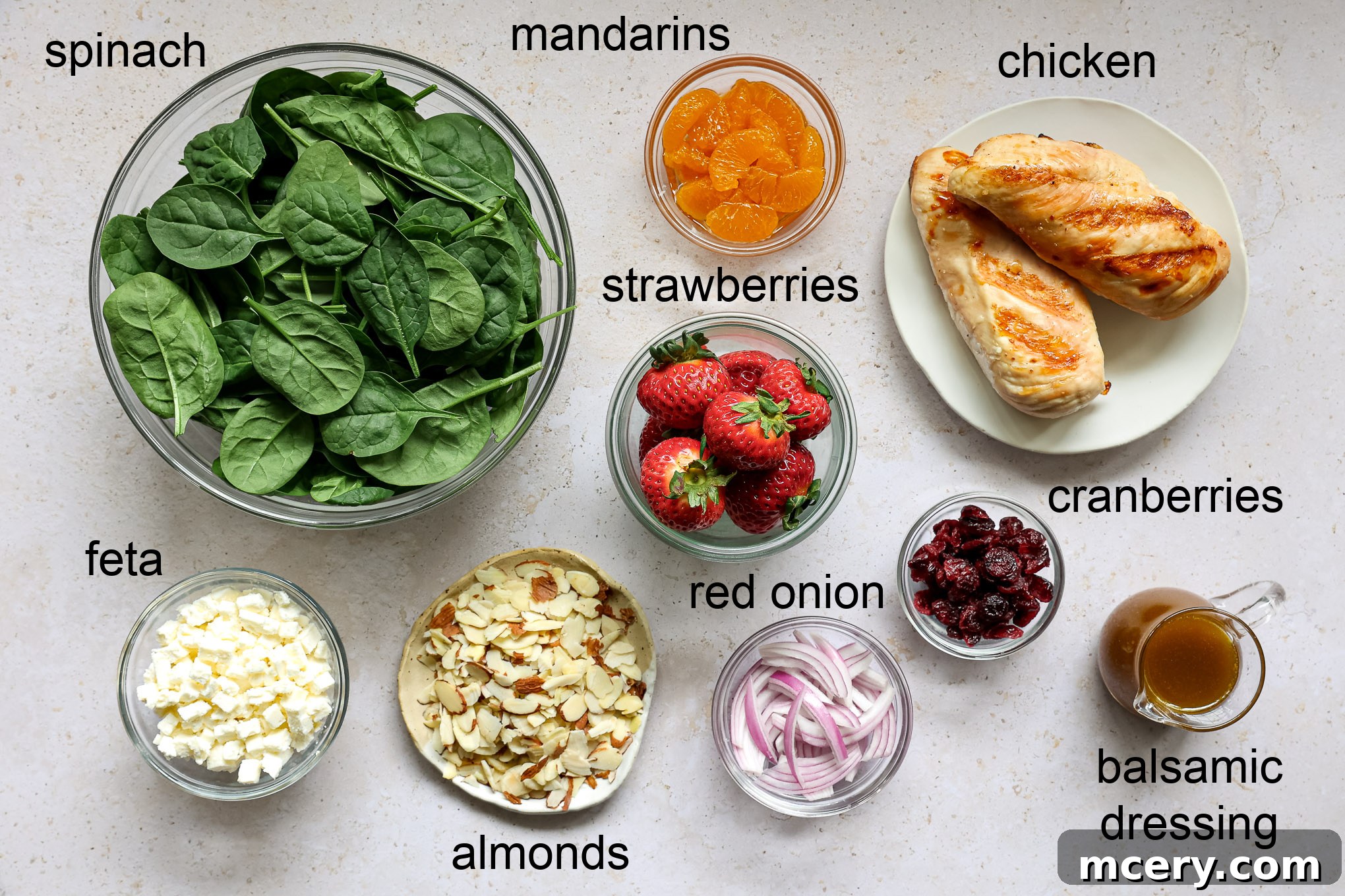 Vibrant Strawberry Chicken Salad 2 A flat lay photograph showcasing all the fresh ingredients for strawberry spinach salad with chicken.
