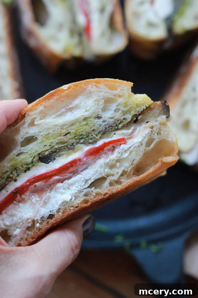 Italian Prosciutto Delight 2 A close-up of a ciabatta sandwich filled with prosciutto, fresh mozzarella, and vegetables, ready to be pressed.