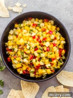 Salsa with pineapple and mango in a bowl