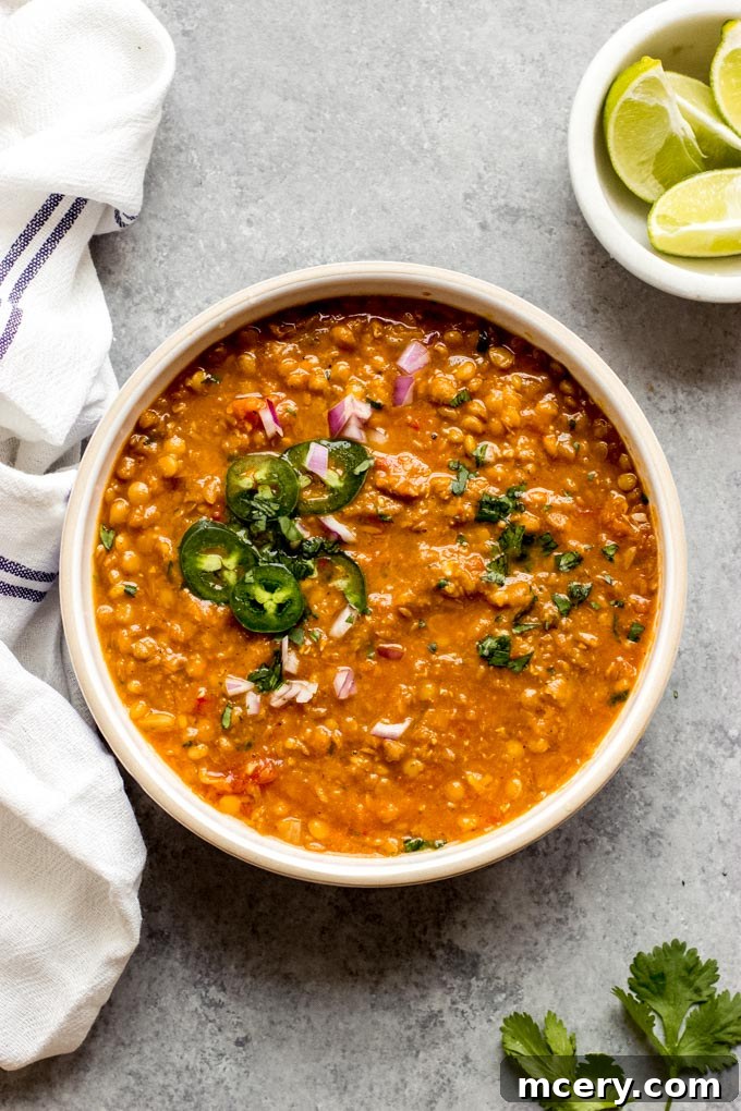 Plant-Powered Lentil Chili 2 A hearty bowl of vegan lentil chili garnished with fresh cilantro, ready to be enjoyed.