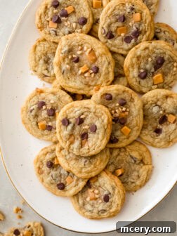 Caramel Toffee Cookies on a white platter, ready to be served.