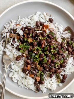 Mexican Beans and Rice recipe, smokey black beans and rice served over white rice.
