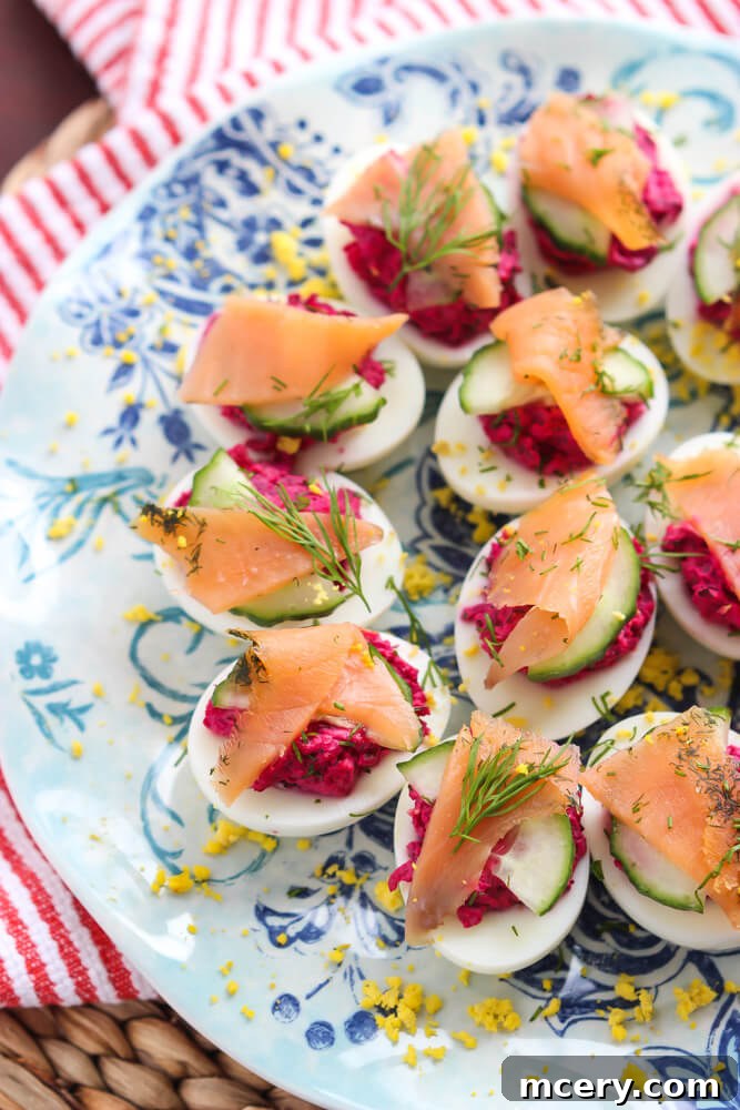 Gourmet Smoked Salmon Deviled Eggs 2 Delicious deviled eggs with smoked salmon, vibrant beet filling, fresh cucumbers, and fragrant dill. An ideal appetizer for festive occasions.