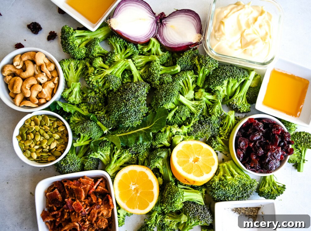 Crispy Broccoli Salad 7 A comprehensive flat lay of all the fresh ingredients needed for the Broccoli Crunch Salad recipe, including broccoli, bacon, cranberries, nuts, and dressing components.
