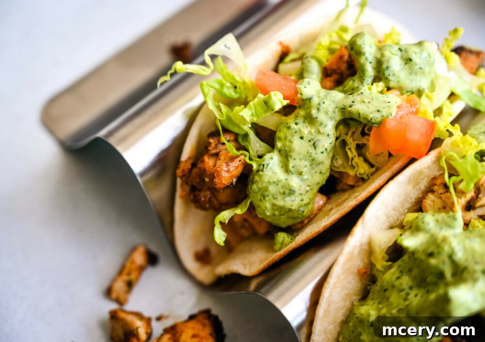 Creamy Cilantro Chicken Tacos 5 Chicken Tacos with Creamy Cilantro Sauce, ready to be eaten