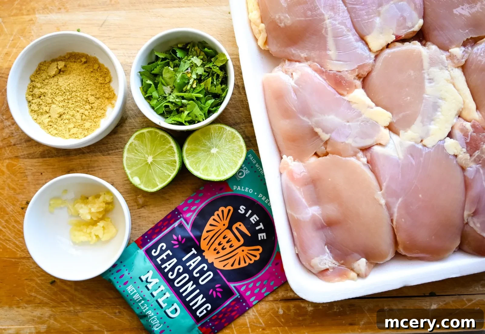 Creamy Cilantro Chicken Tacos 6 Chicken thighs marinating in a bowl